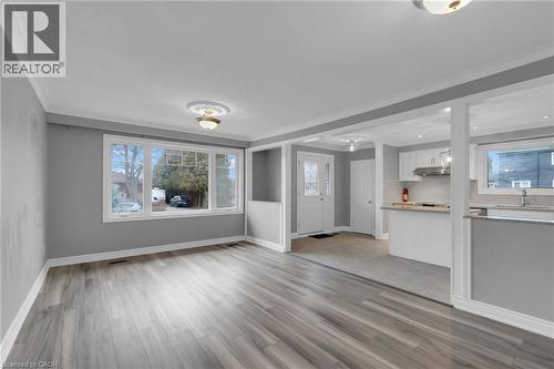 Living space featuring wide plank wood-finish flooring, a large bay window, crown molding, and recessed lighting - 197 Troy Street, Mississauga, ON - Indoor Photo Showing Other Room