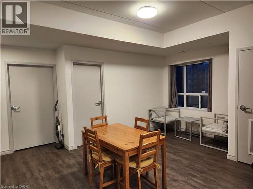 Dining room with dark wood-type flooring - 269 Sunview Street Unit# 607, Waterloo, ON - Indoor Photo Showing Dining Room
