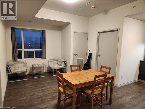 Dining room with dark wood-style floors and baseboards - 269 Sunview Street Unit# 607, Waterloo, ON - Indoor Photo Showing Dining Room