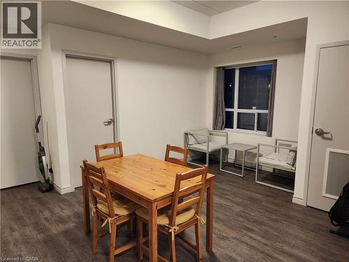 Dining room featuring dark wood-style flooring - 269 Sunview Street Unit# 607, Waterloo, ON - Indoor Photo Showing Dining Room