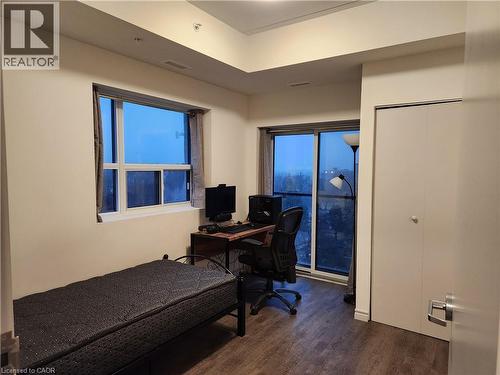 Furnished bedroom with dark wood finished floors and visible vents - 269 Sunview Street Unit# 607, Waterloo, ON - Indoor