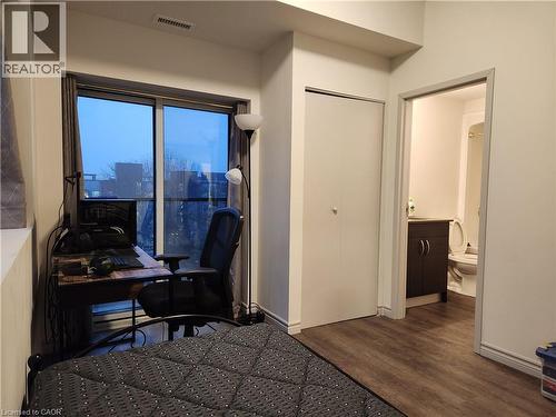 Furnished bedroom with wood finished floors and visible vents - 269 Sunview Street Unit# 607, Waterloo, ON - Indoor Photo Showing Other Room