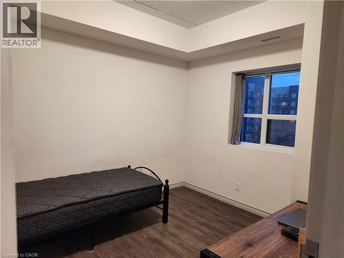 Bedroom featuring visible vents, baseboards, and wood finished floors - 269 Sunview Street Unit# 607, Waterloo, ON - Indoor Photo Showing Bedroom