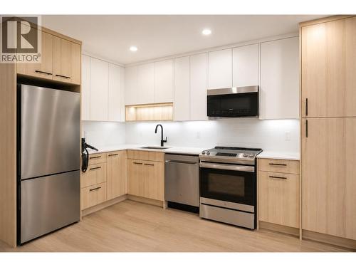 Virtually staged - 1380 Pridham Avenue Unit# 409, Kelowna, BC - Indoor Photo Showing Bedroom