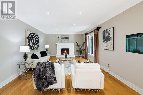 Spacious family room with cozy fireplace - 5859 Riverside Place, Mississauga, ON - Indoor With Fireplace