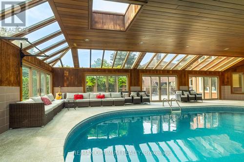 Year-round pool retreat with walkout - 5859 Riverside Place, Mississauga, ON - Indoor Photo Showing Other Room With In Ground Pool