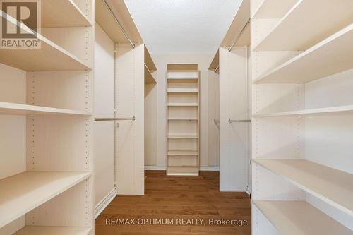 Custom walk-in closet with organizers - 5859 Riverside Place, Mississauga, ON - Indoor With Storage
