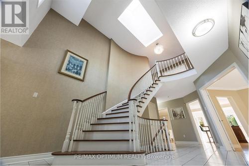 Grand circular staircase with skylight - 5859 Riverside Place, Mississauga, ON - Indoor Photo Showing Other Room