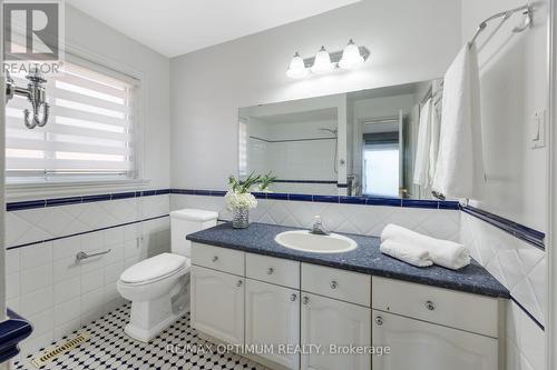 Updated bath with classic tile accents - 5859 Riverside Place, Mississauga, ON - Indoor Photo Showing Bathroom