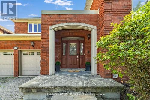 Elegant arched entry with stone porch - 5859 Riverside Place, Mississauga, ON - Outdoor With Exterior
