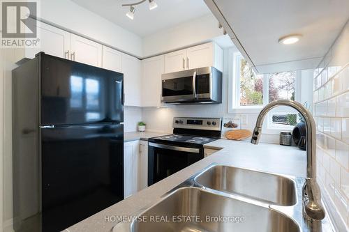 B17 - 240 Ormond Drive, Oshawa, ON - Indoor Photo Showing Kitchen With Double Sink