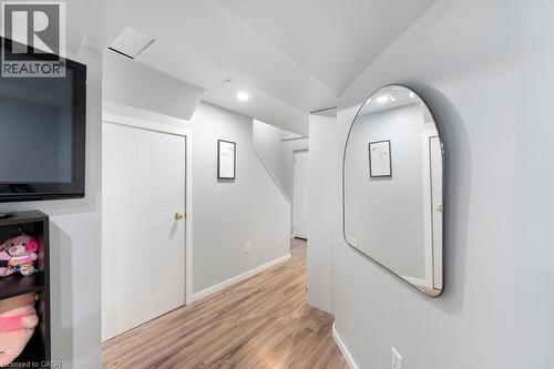 Hallway featuring wood-finish flooring, light grey walls, white trim, and recessed lighting - 33 Remple Court, Cambridge, ON - Indoor Photo Showing Other Room