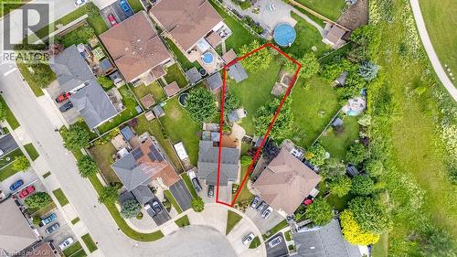 Generous lot outlined in red, featuring a residential property with a multi-car driveway, and a spacious backyard with mature trees - 33 Remple Court, Cambridge, ON - Other