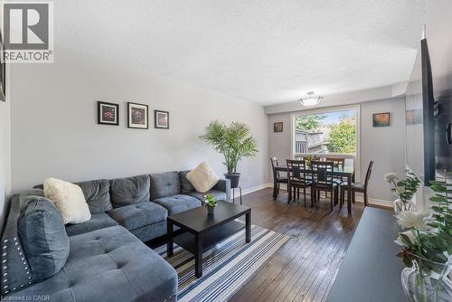 Open-concept living and dining area featuring wood-finish flooring - 33 Remple Court, Cambridge, ON - Indoor Photo Showing Living Room