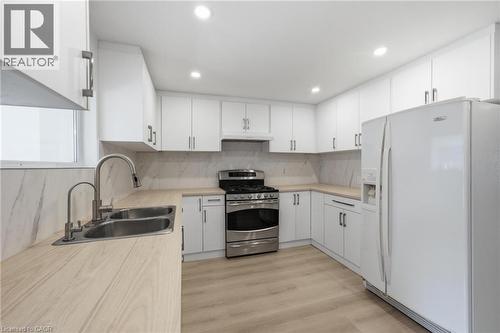 1062 Cannon Street E, Hamilton, ON - Indoor Photo Showing Kitchen With Double Sink