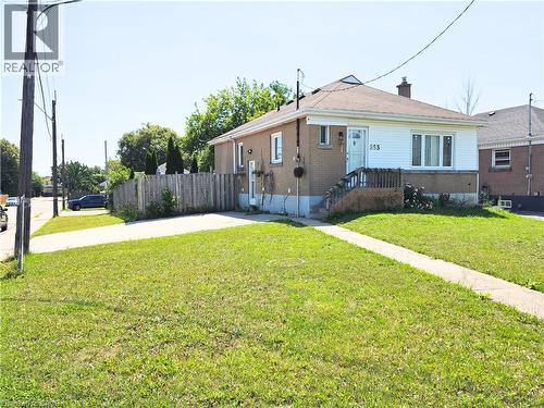 Brick and siding exterior with a pitched roof - 353 East 21St Street, Hamilton, ON - Outdoor