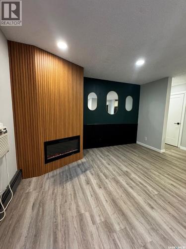 303 365 Kingsmere Boulevard, Saskatoon, SK - Indoor Photo Showing Other Room With Fireplace