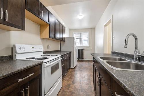 B-415 Stradbrook Ave, Winnipeg, MB - Indoor Photo Showing Kitchen With Double Sink