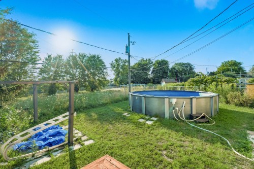 Cour - 6560 Rue Villon, Brossard, QC - Outdoor With Above Ground Pool With Backyard