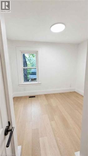 Hardwood flooring, recessed ceiling light, white trim, rectangular window - 561 Wentworth Street N, Hamilton, ON - Indoor Photo Showing Other Room