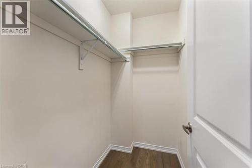 Walk in closet with dark wood-style floors - 13 Steven Drive, Thorold, ON - Indoor With Storage