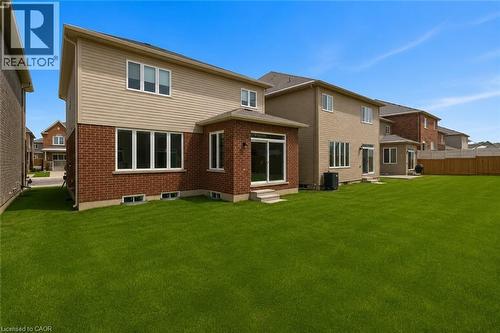 Expansive green lawn with a newly built home featuring brick and siding exterior - 13 Steven Drive, Thorold, ON - Outdoor With Exterior