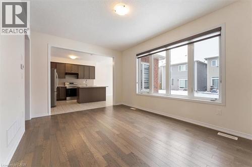 Unfurnished living room featuring wood finished floors, visible vents, and baseboards - 13 Steven Drive, Thorold, ON - Indoor Photo Showing Other Room