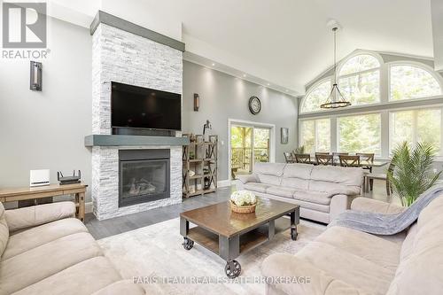 7 Duquette Court, Tiny, ON - Indoor Photo Showing Living Room With Fireplace