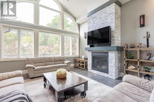 7 Duquette Court, Tiny, ON - Indoor Photo Showing Living Room With Fireplace