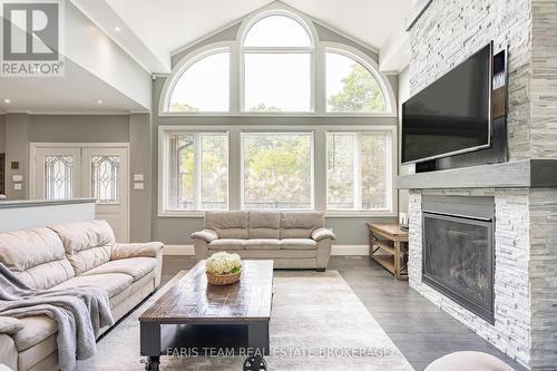 7 Duquette Court, Tiny, ON - Indoor Photo Showing Living Room With Fireplace