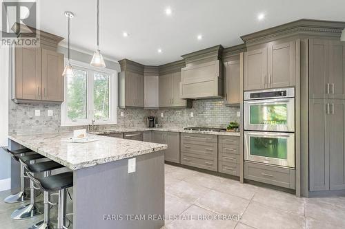 7 Duquette Court, Tiny, ON - Indoor Photo Showing Kitchen With Upgraded Kitchen