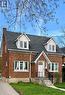Brick exterior with white trim, featuring a gabled entry porch, dark shingle roof, and two dormer windows - 49 West Avenue, Kitchener, ON  - Outdoor 