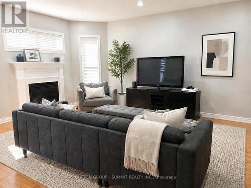 910 Knotty Pine Grove, Mississauga, ON - Indoor Photo Showing Living Room With Fireplace
