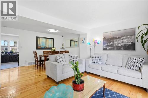 Hardwood flooring throughout, recessed lighting, and a dedicated dining space - 145 Rice Avenue Unit# 2, Hamilton, ON - Indoor Photo Showing Living Room