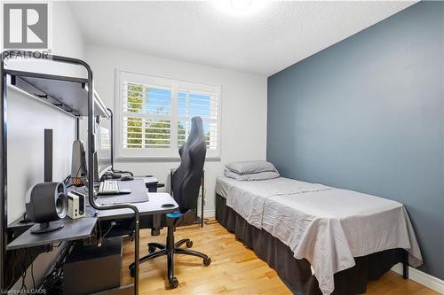 Hardwood flooring, window with louvered shutters, light blue accent wall, recessed lighting - 145 Rice Avenue Unit# 2, Hamilton, ON - Indoor