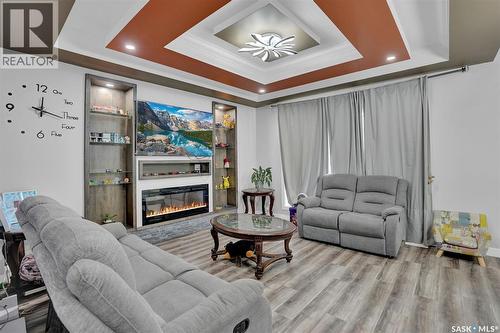 3204 Crosbie Crescent, Regina, SK - Indoor Photo Showing Living Room With Fireplace