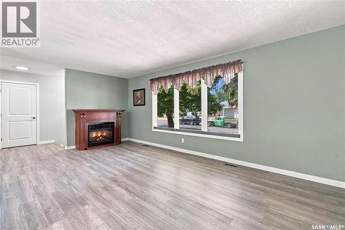 1227 Pascoe Drive E, Moose Jaw, SK - Indoor Photo Showing Living Room With Fireplace