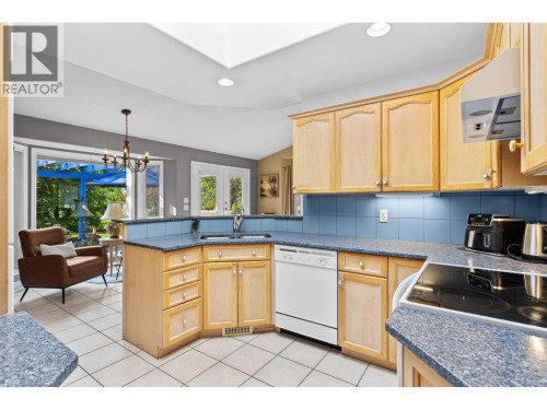 Bright skylight in kitchen. - 4000 Gallaghers Terrace, Kelowna, BC - Indoor Photo Showing Kitchen With Double Sink