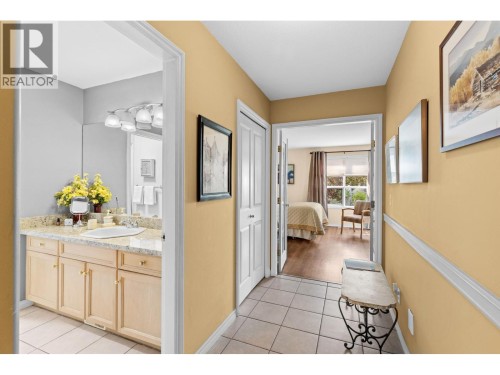 French doors leading to primary bedroom.  Bathroom. - 4000 Gallaghers Terrace, Kelowna, BC - Indoor Photo Showing Other Room