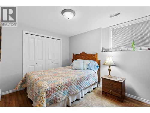 1st bedroom downstairs. - 4000 Gallaghers Terrace, Kelowna, BC - Indoor Photo Showing Bedroom
