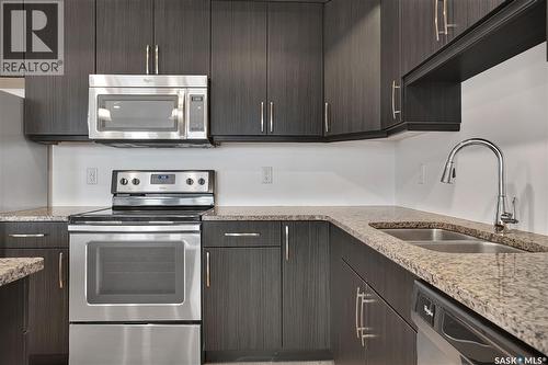 308 770 Childers Crescent, Saskatoon, SK - Indoor Photo Showing Kitchen With Stainless Steel Kitchen With Double Sink With Upgraded Kitchen