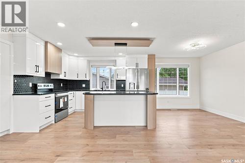 702 Mckercher Drive, Saskatoon, SK - Indoor Photo Showing Kitchen With Upgraded Kitchen