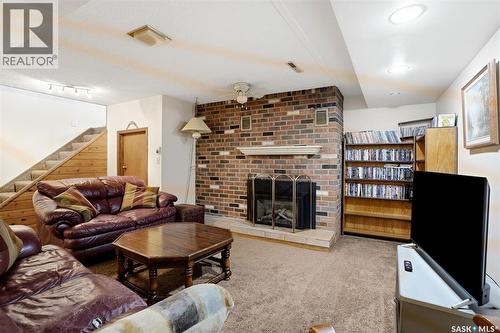 60 Krivel Crescent, Regina, SK - Indoor Photo Showing Living Room With Fireplace