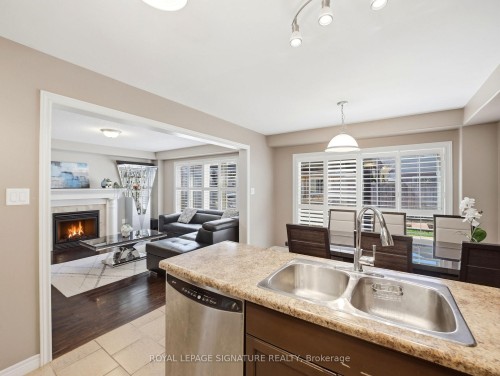 98 Willow Lane, Grimsby, ON - Indoor Photo Showing Kitchen With Fireplace With Double Sink
