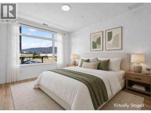 Primary Bedroom - virtually staged to show possibilities - 2780 Olalla Road Unit# 201, West Kelowna, BC - Indoor Photo Showing Bedroom