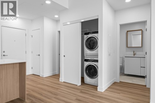 Laundry and Foyer - 2780 Olalla Road Unit# 201, West Kelowna, BC - Indoor Photo Showing Laundry Room