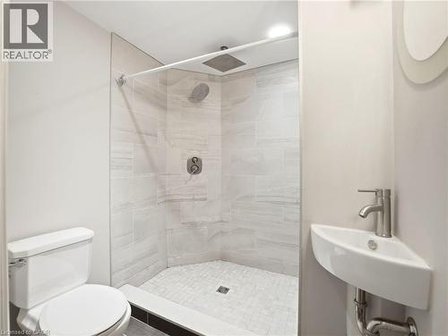 Walk-in shower with full-height tile surround and rain shower head - 98 Willow Lane, Grimsby, ON - Indoor Photo Showing Bathroom
