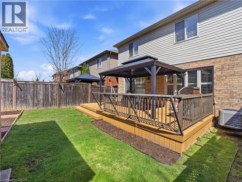 Backyard featuring a multi-level wood-finish deck with dark-toned railings - 98 Willow Lane, Grimsby, ON - Outdoor