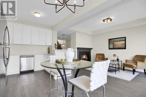 207 Willow Aster Circle, Ottawa, ON - Indoor Photo Showing Dining Room With Fireplace