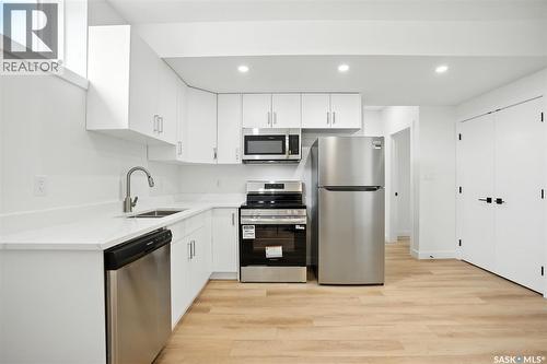 138 Sharma Lane, Saskatoon, SK - Indoor Photo Showing Kitchen With Double Sink